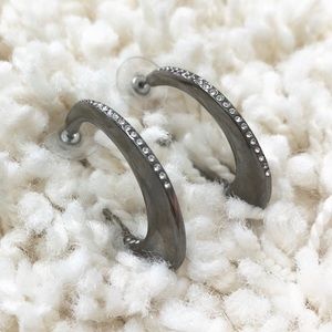 Express dark silver hoop earrings with crystals